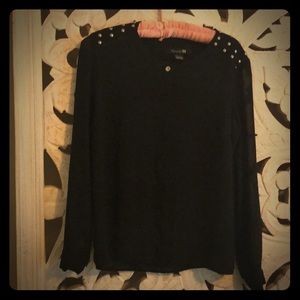 Sheer black top with shoulder details